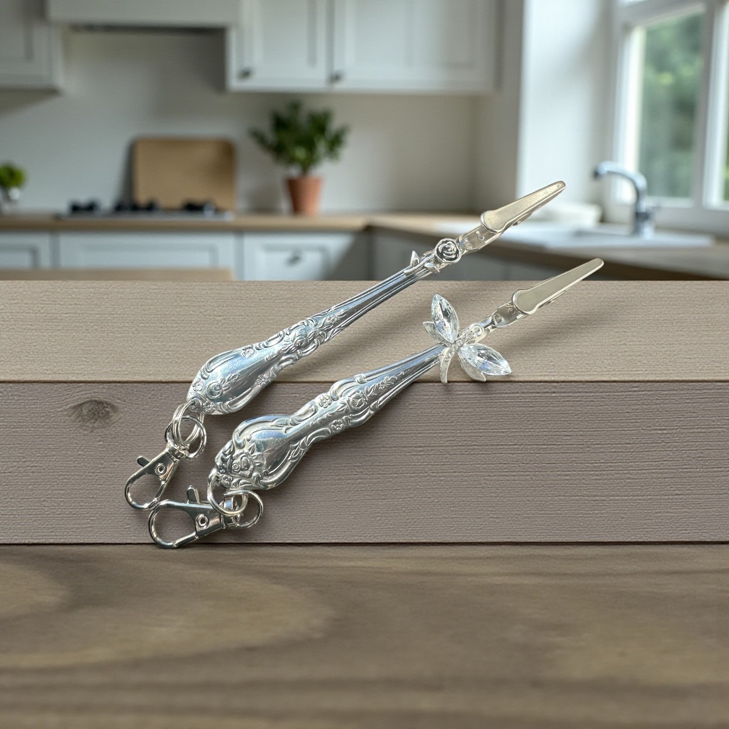 Decorative silver atm card
 clip on a wooden surface with a kitchen in the background