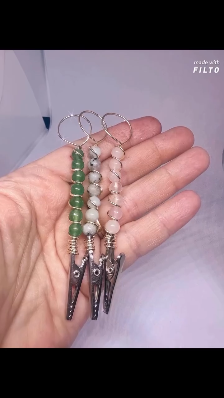 Genuine Gemstone Beaded ATM card clip bracelet helper, shown in a hand with three colorful wire-wrapped clips made of green, gray, and pink beads, ideal for creative displays.