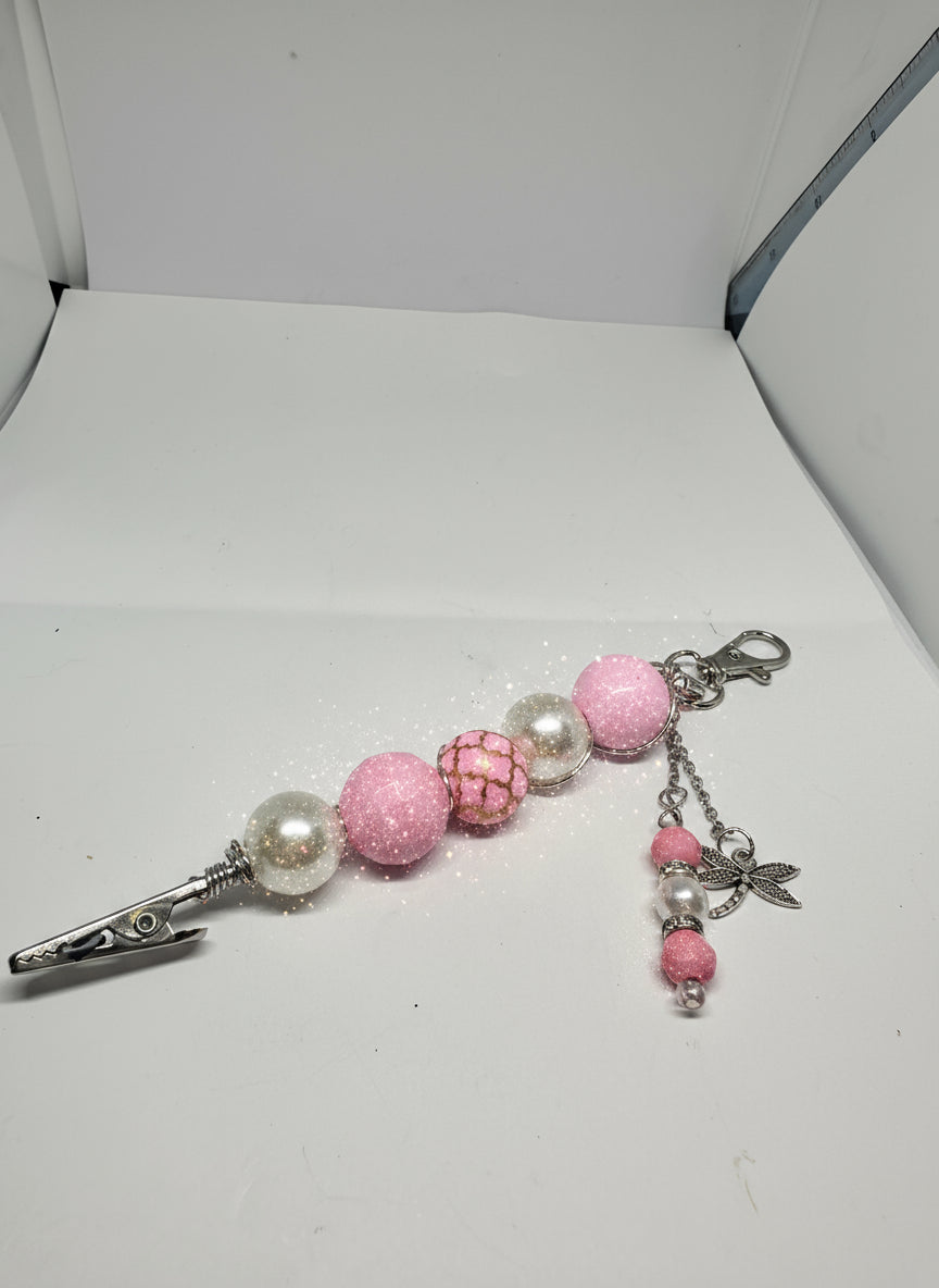 Beaded keychain  atm card clip with pink and white beads on a white background