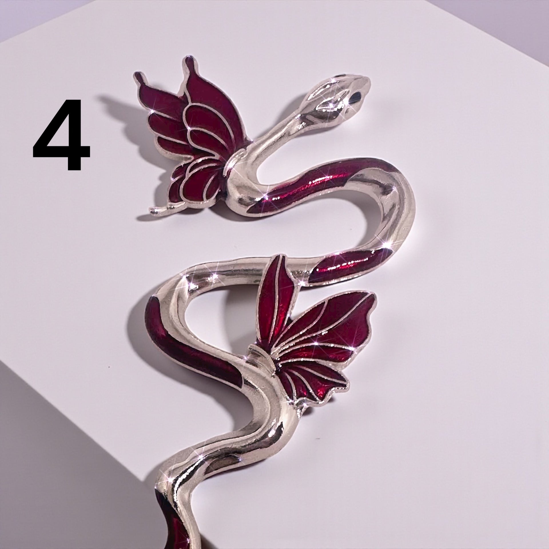 Charming ATM Card Clip Tool with a snake and flower design, perfect for effortless bracelet fastening.