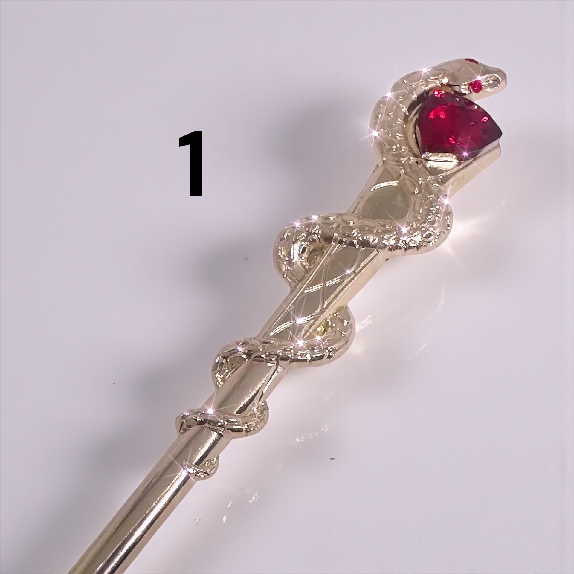 ATM Card Clip Tool featuring a stylish snake design with a ruby gem, perfect for long nail lovers.