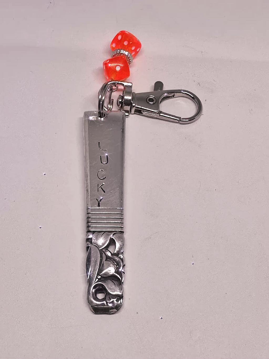 Front view of a Hand-Stamped Lucky Scratch Card Keychain – Upcycled Spoon with Dice Charm, showcasing the engraved 'LUCKY' text and vibrant dice charm detail.