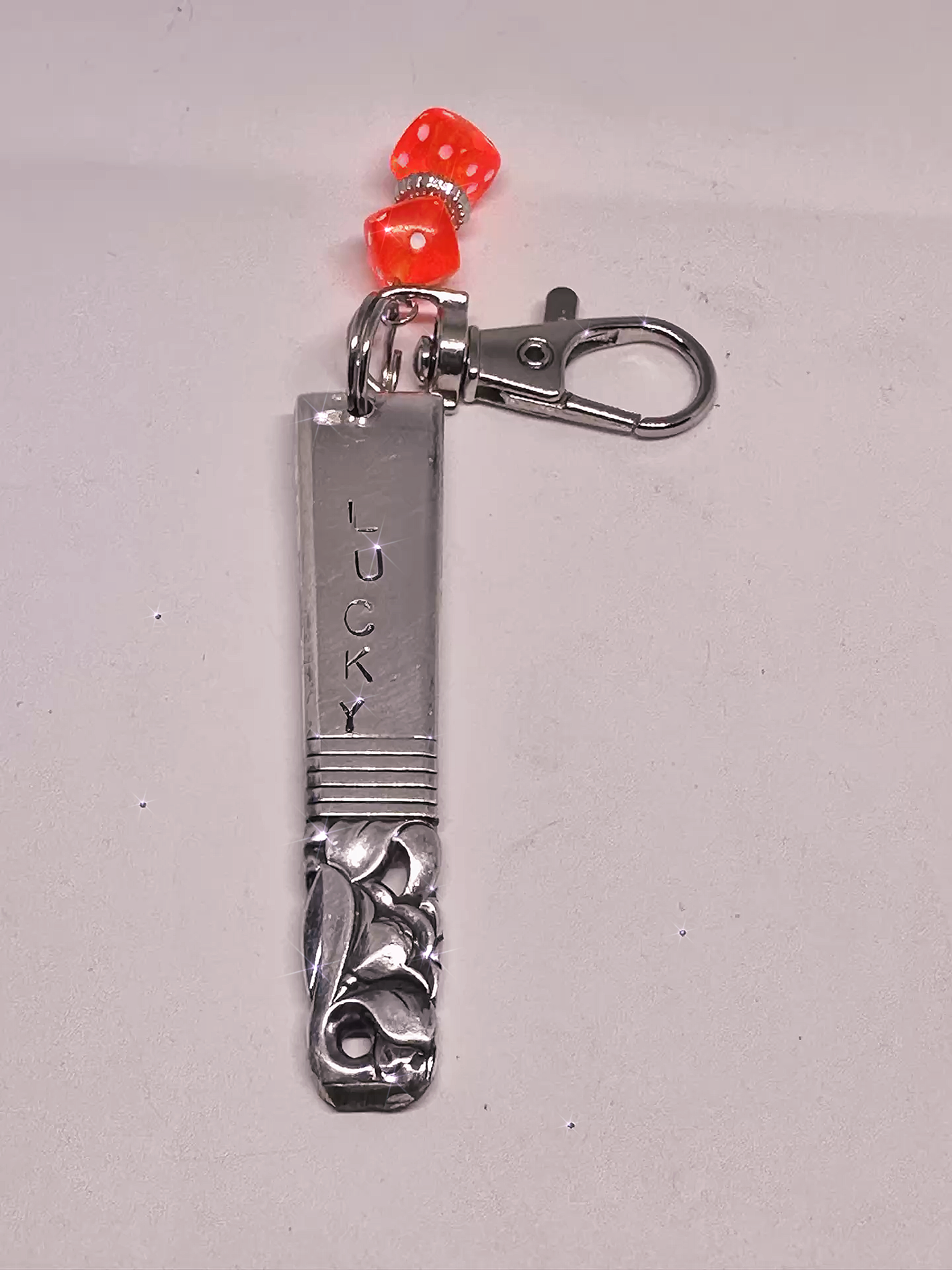 Front view of a Hand-Stamped Lucky Scratch Card Keychain – Upcycled Spoon with Dice Charm, showcasing the engraved 'LUCKY' text and vibrant dice charm detail.