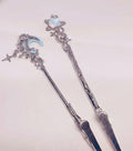 Bracelet Helper & ATM Card Clip featuring a decorative design with celestial and fantasy accents, perfect for those with long nails or limited dexterity. Ideal for pulling on tight bracelets and retrieving small objects.