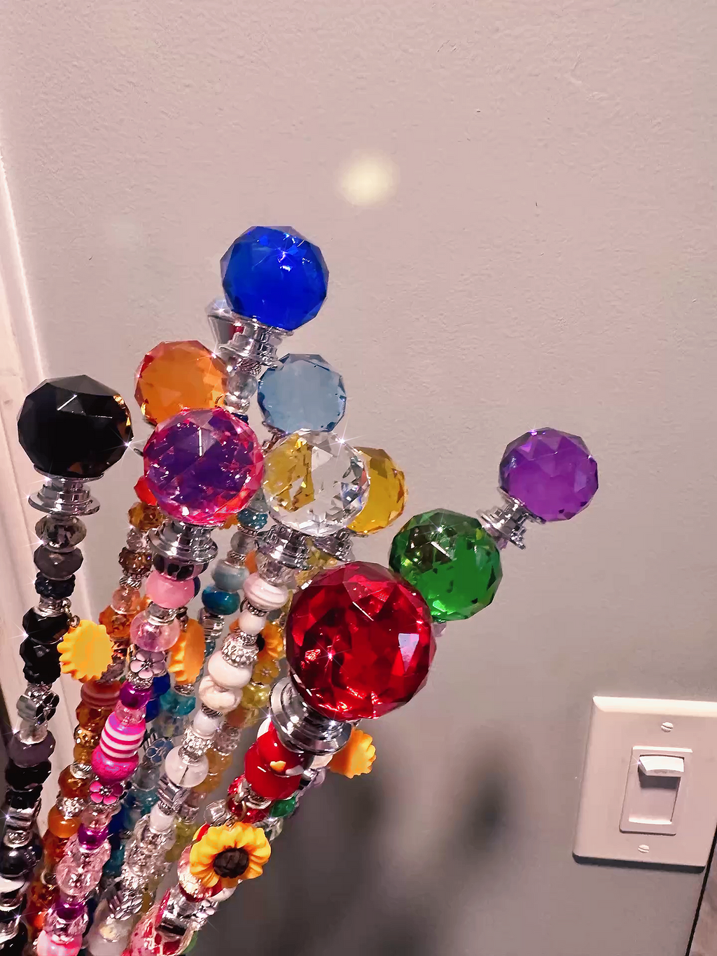 Detailed view of the tops of Garden Fairy Wands showing vibrant colors and designs, perfect for enhancing any plant lover's collection.