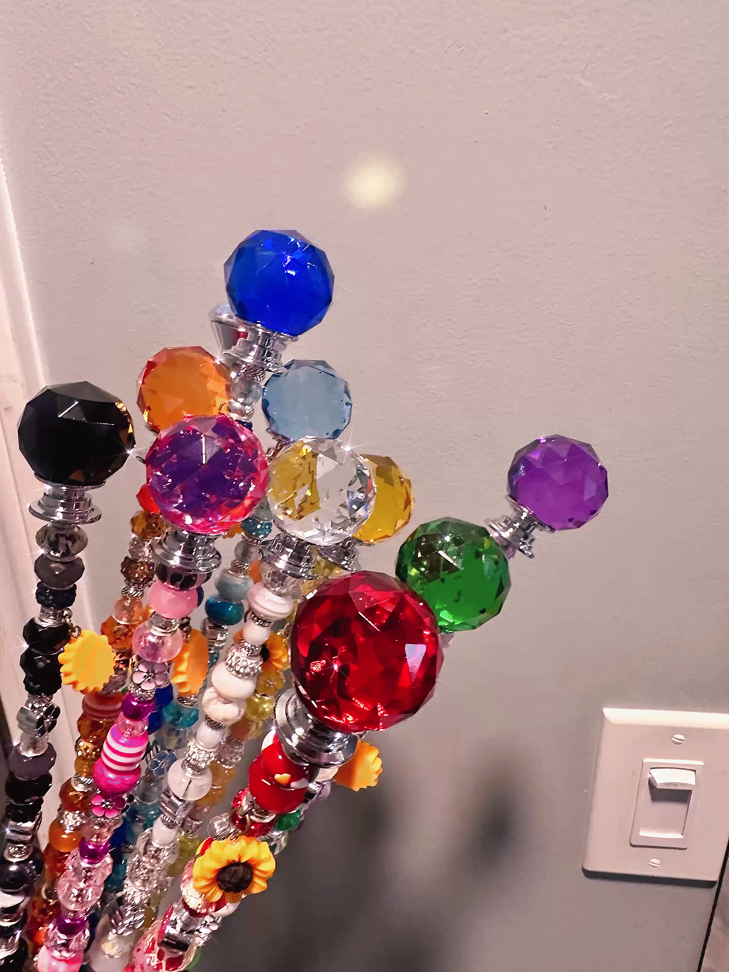 Detailed view of the tops of Garden Fairy Wands showing vibrant colors and designs, perfect for enhancing any plant lover's collection.