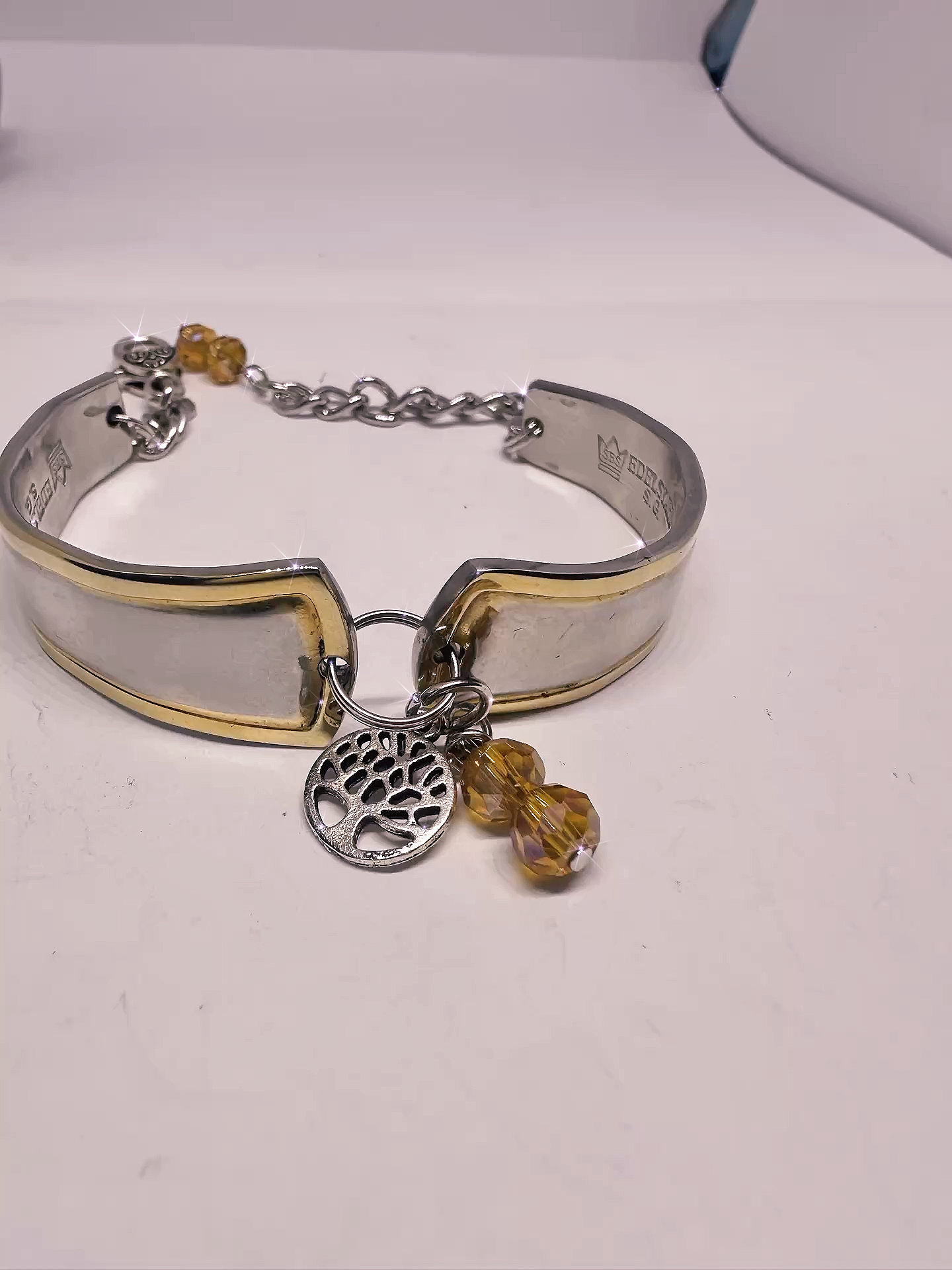 Model wearing the Upcycled Goldspoon & Crystal Bead Bracelet, demonstrating the charm and style of this unique gold spoon bracelet.