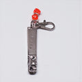 Hand-Stamped Lucky Scratch Card Keychain featuring a vintage spoon handle, stamped with 'LUCKY,' and adorned with a playful red dice charm.