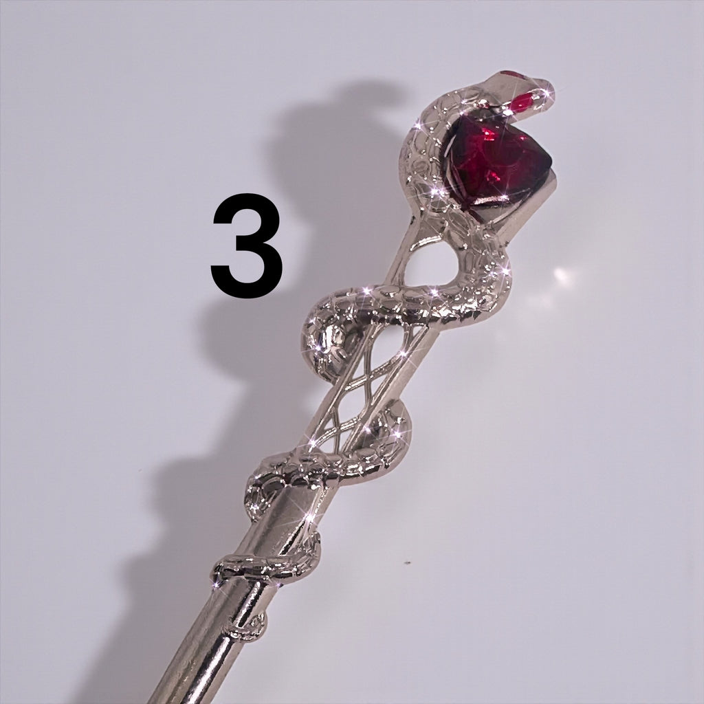 Detailed view of the ATM Card Clip Tool with a snake and gemstone design, demonstrating its functional beauty for long nails and bracelet wearers.