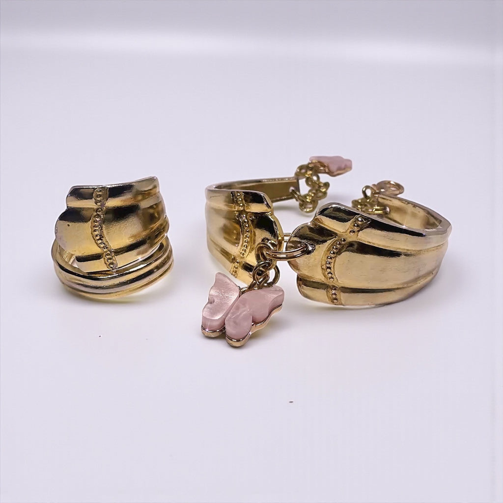 Gold Spoon Ring & Bracelet Set – Textured Design with Pink Butterfly Char showing a beautifully handcrafted ring and bracelet made from vintage flatware, featuring a pink butterfly charm.
