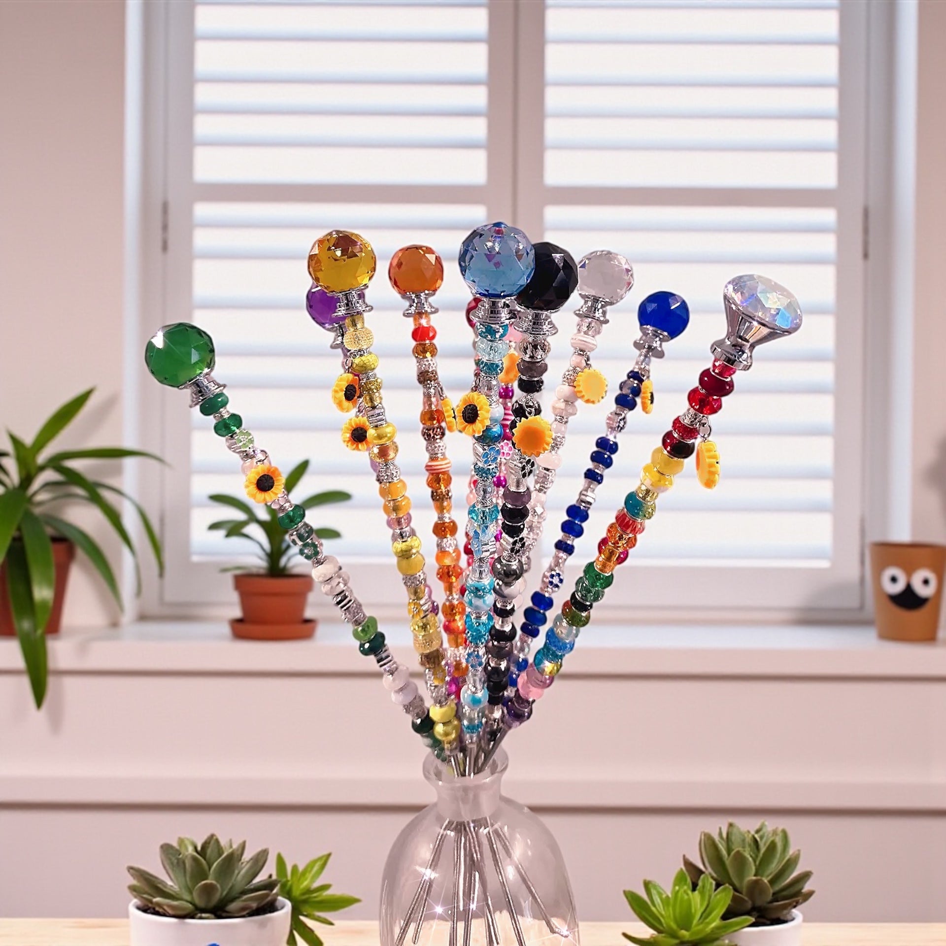 Vibrant Garden Fairy Wands in a bright room, showcasing their decorative design and charm, making them excellent gifts for plant lovers.