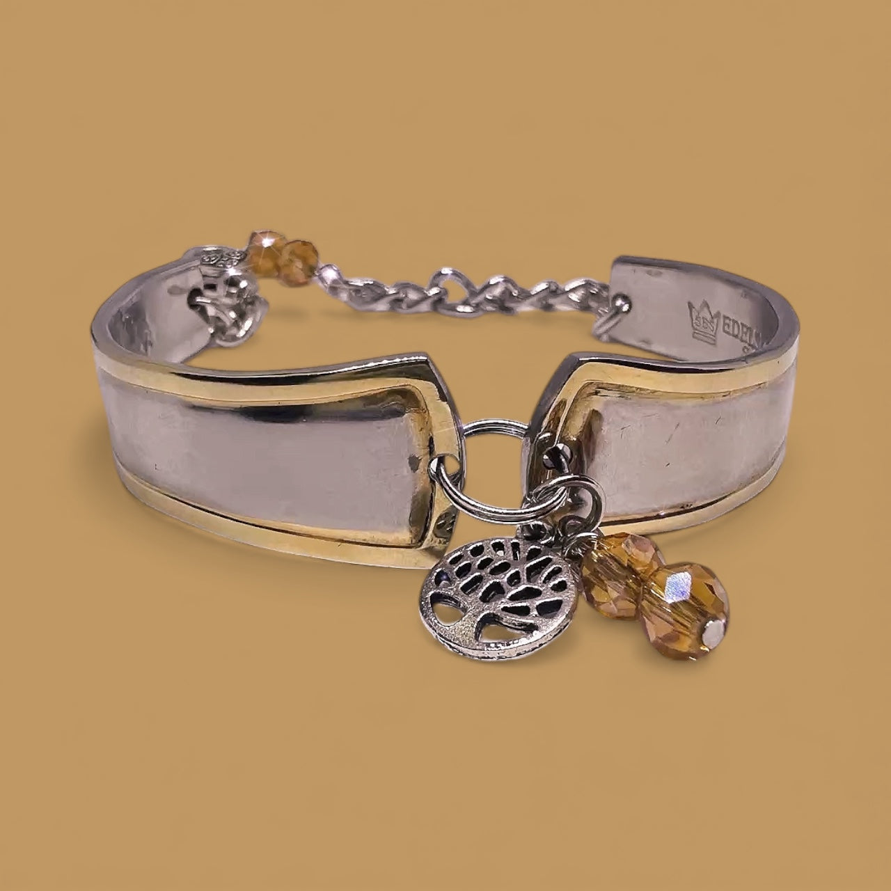 Stylish display of the Upcycled Goldspoon & Crystal Bead Bracelet featuring a repurposed gold spoon handle, ideal for lovers of gold spoon bracelet jewelry.