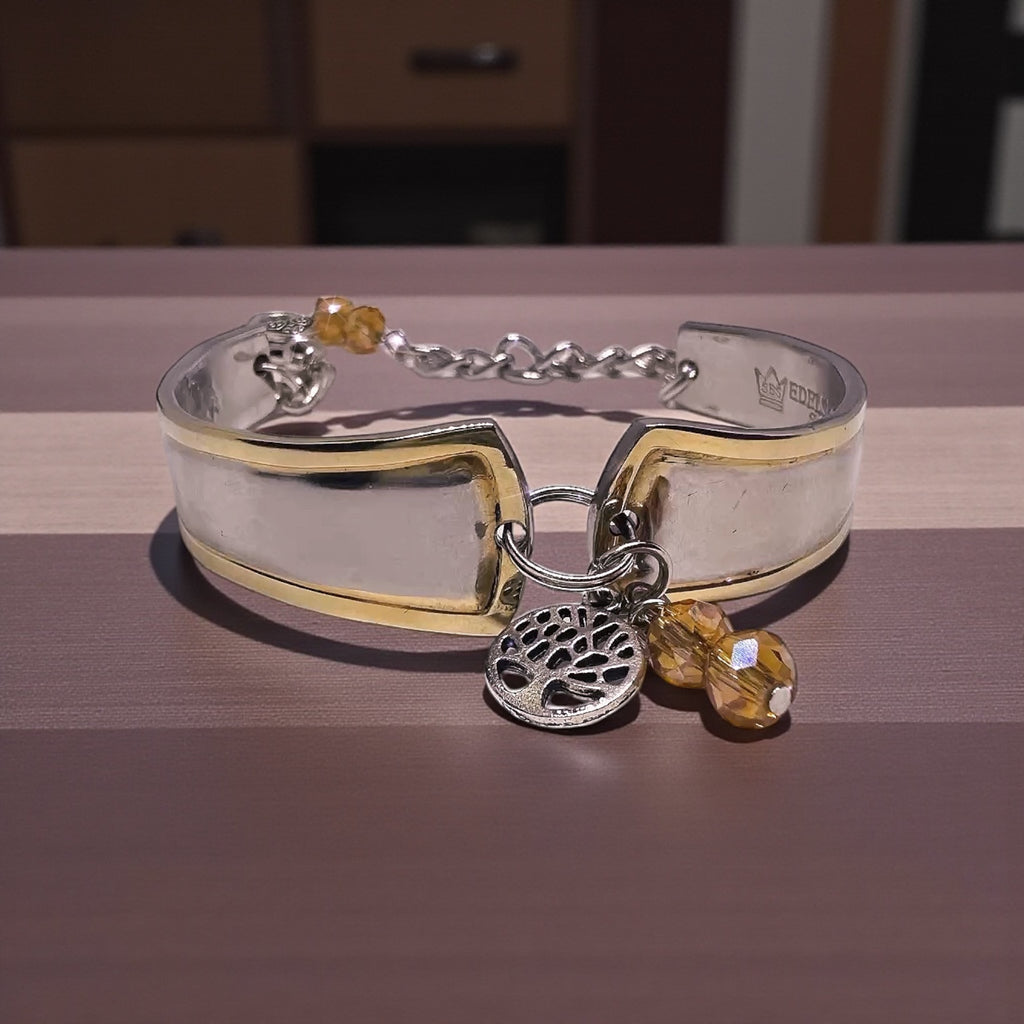 Detailed view of the tree charm on the Upcycled Goldspoon & Crystal Bead Bracelet, adding a nature-inspired touch to this gold spoon bracelet.