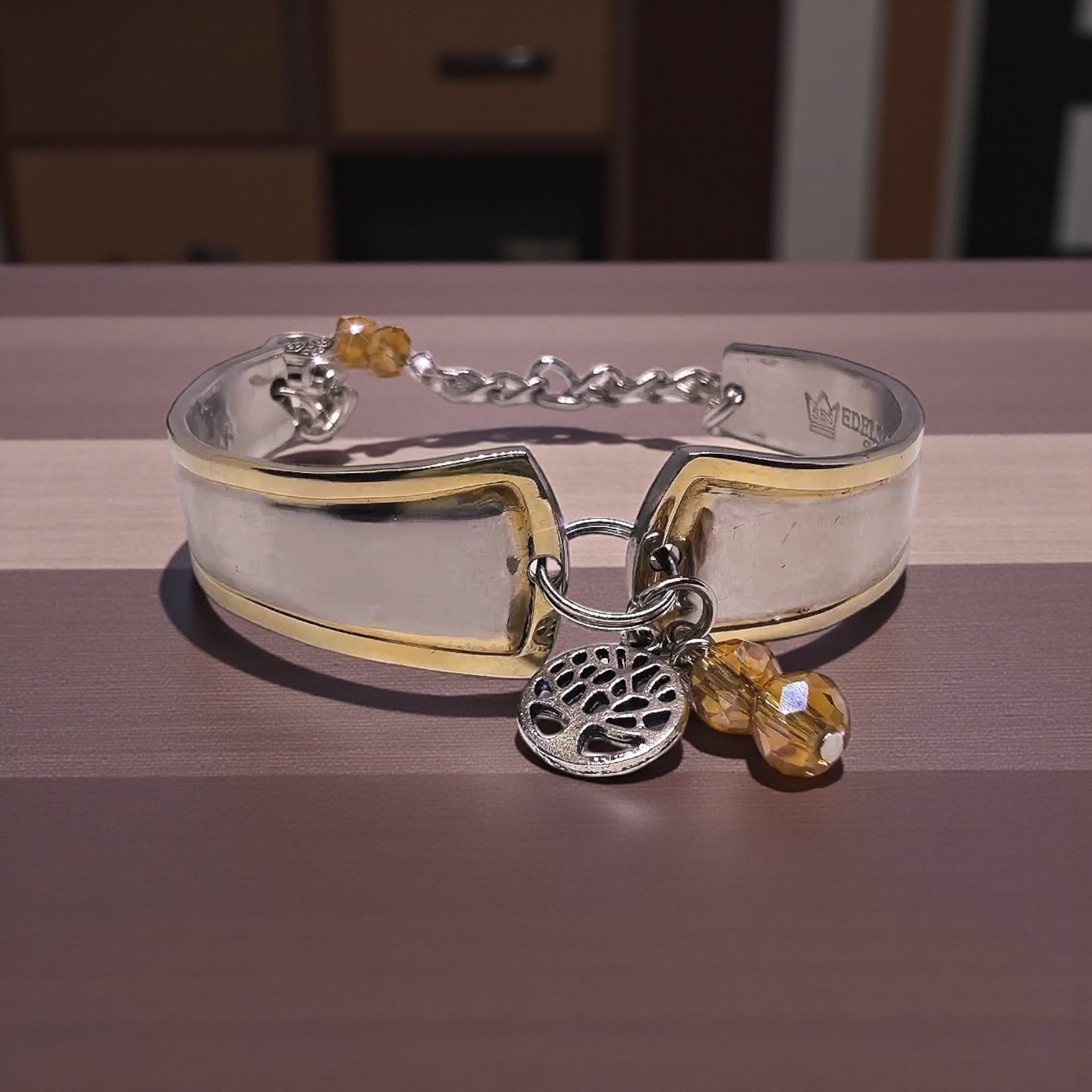 Detailed view of the tree charm on the Upcycled Goldspoon & Crystal Bead Bracelet, adding a nature-inspired touch to this gold spoon bracelet.