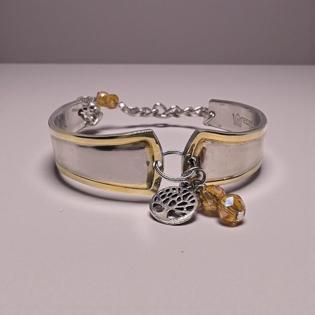 Close-up of the Upcycled Goldspoon & Crystal Bead Bracelet highlighting amber crystal beads and a silver-tone tree charm, perfect for gold spoon bracelet enthusiasts.
