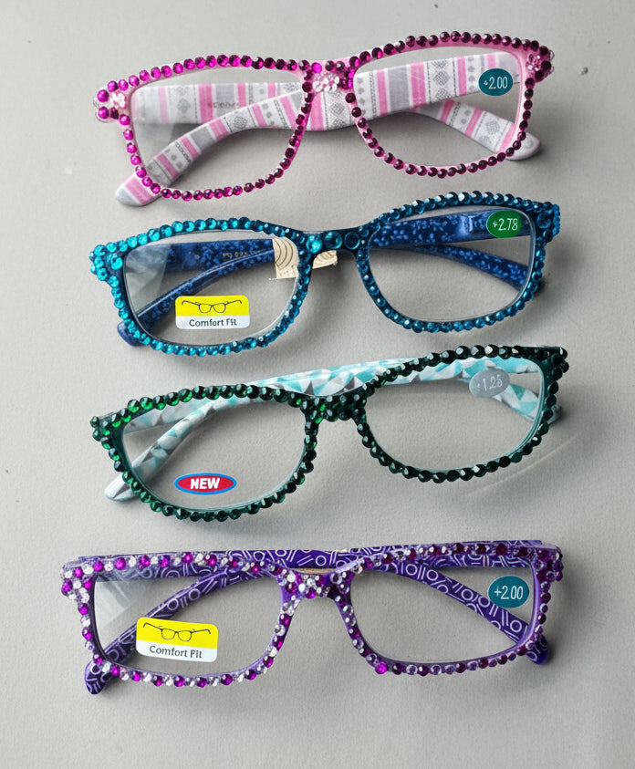 Decorative eyeglass frames on a gray surface