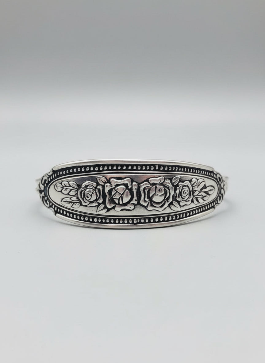 Close-up view of the Amethyst Spoon Bracelet showcasing intricate floral engravings on stainless steel, perfect for those who appreciate vintage jewelry.