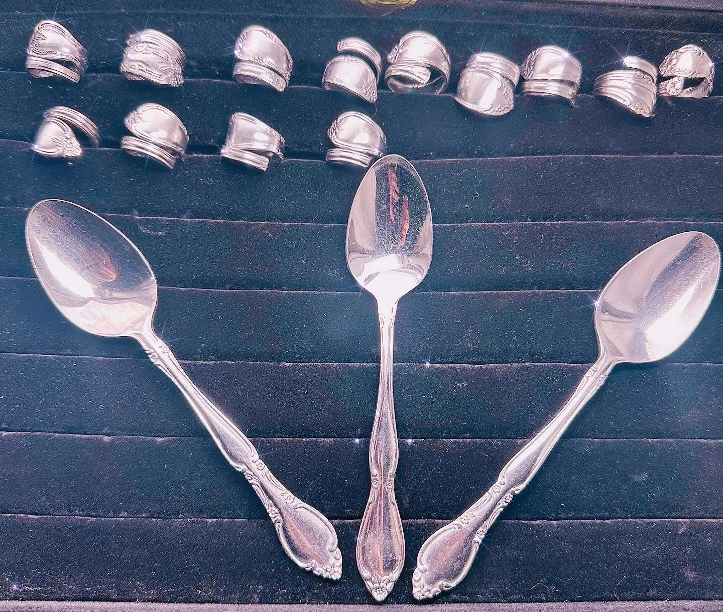 Custom Spoon Jewelry - Collection of silver spoons showcasing various shapes and styles, perfect for turning into personalized jewelry.