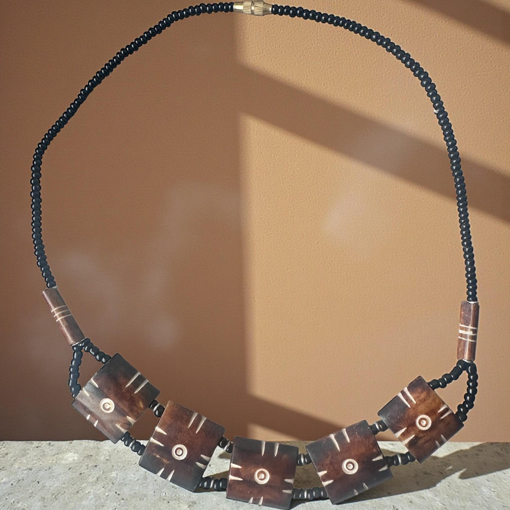 Carved Bone Sunburst Necklace • Boho Tribal Pendant, Black Seed Beads