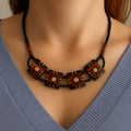 Carved Bone Sunburst Necklace • Boho Tribal Pendant, Black Seed Beads