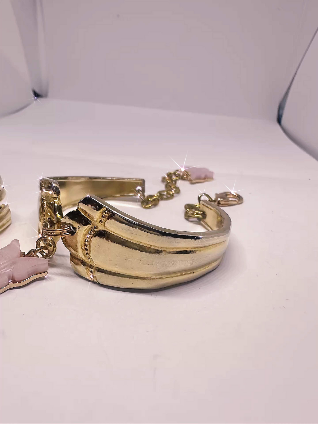 Detailed view of the Gold Spoon Bracelet from the Gold Spoon Ring & Bracelet Set, focusing on the unique texture and pink butterfly charm, perfect for showcasing its handmade quality.